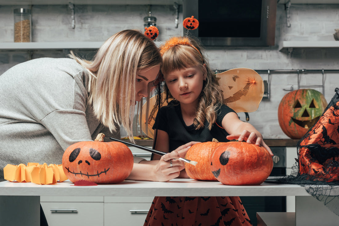 Painting pumpkins to decorate the house for Halloween