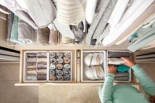 Woman organizing containers in her renovated closet