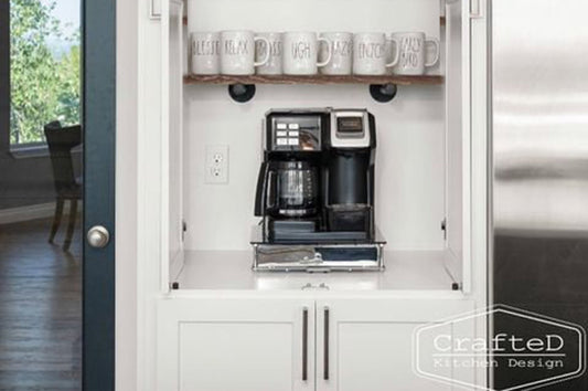 man fixing drinks for guests at his home coffee bar and cocktail nook