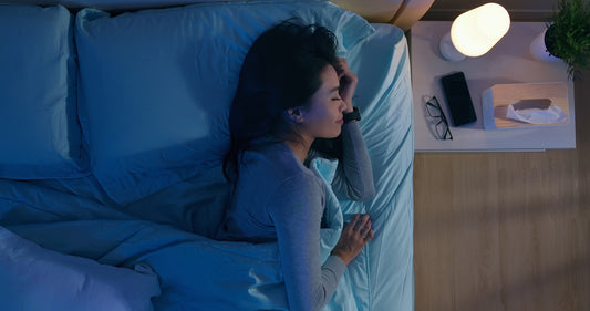 woman waking up in a peaceful, well-designed bedroom