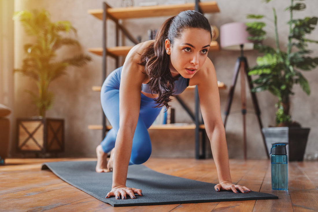 woman doing yoga in her newly organized home gym