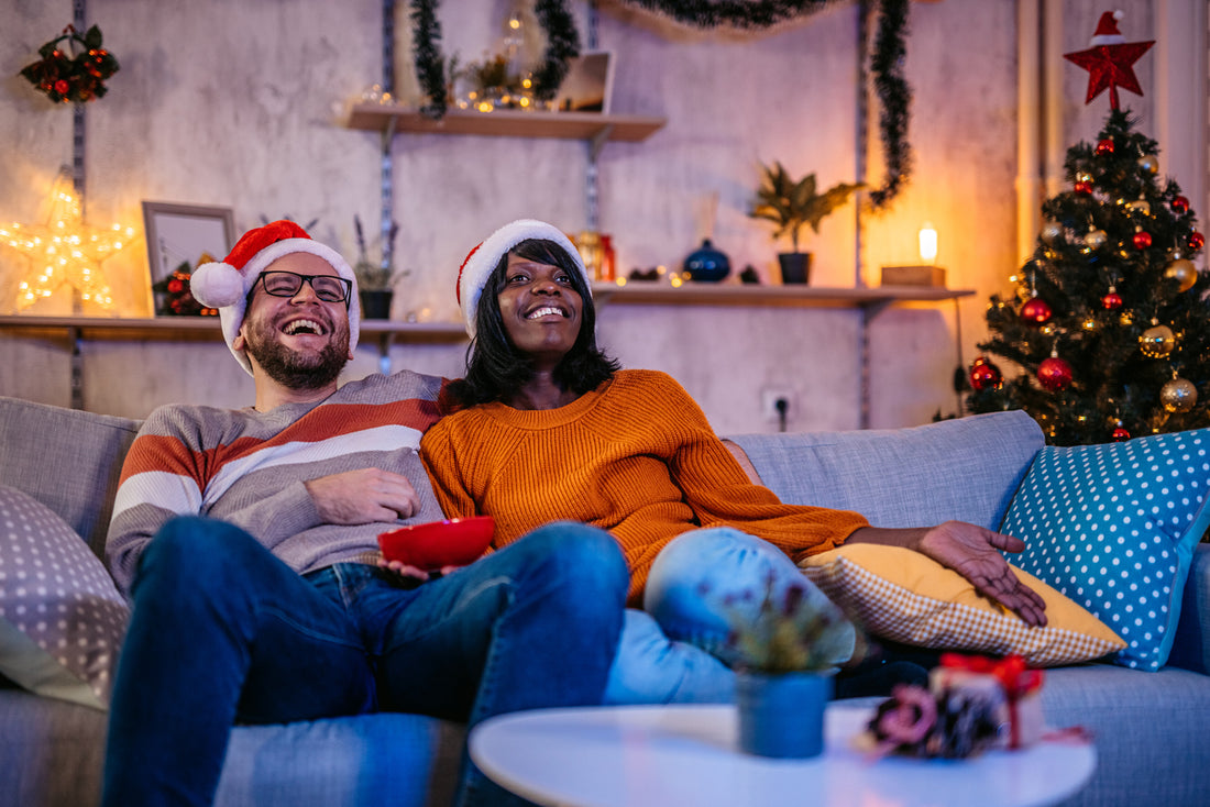 couple enjoying a holiday movie marathon at home