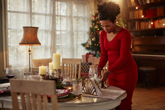 homeowner getting her dining room ready for a holiday dinner party