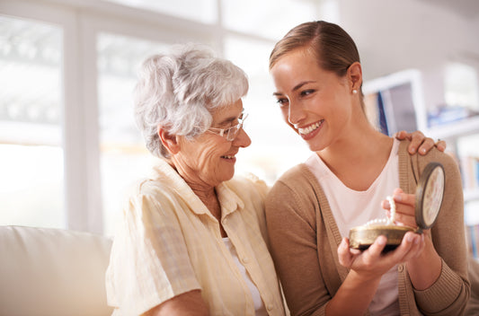 Woman and adult granddaughter packing away valuable jewelry