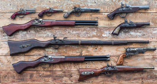 Antique pistol collection about to be stored in a glass gun case