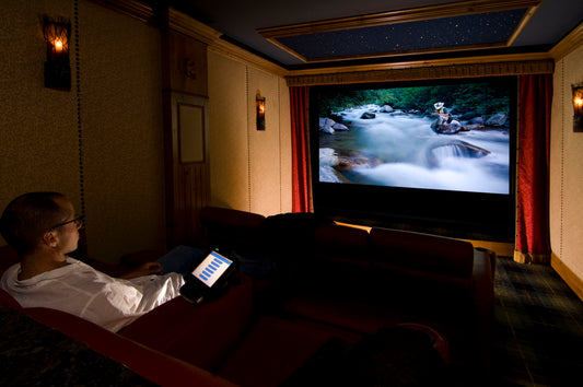 man enjoying a movie after creating a home theater