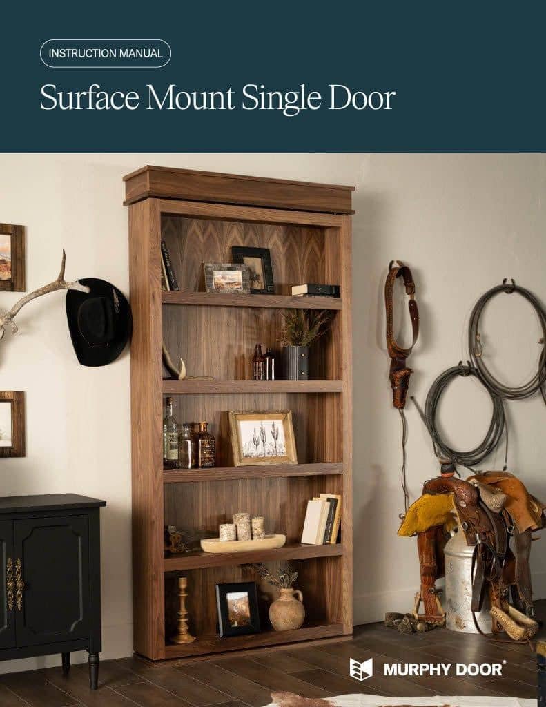 Murphy Door® Surface Mount Single Door dark wood bookshelf, decorated with rustic items, blending into a western-style room.