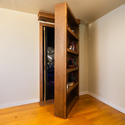 Murphy Door® wooden bookcase door in light oak finish, partially open to reveal hidden room entrance, mounted on hardwood flooring.