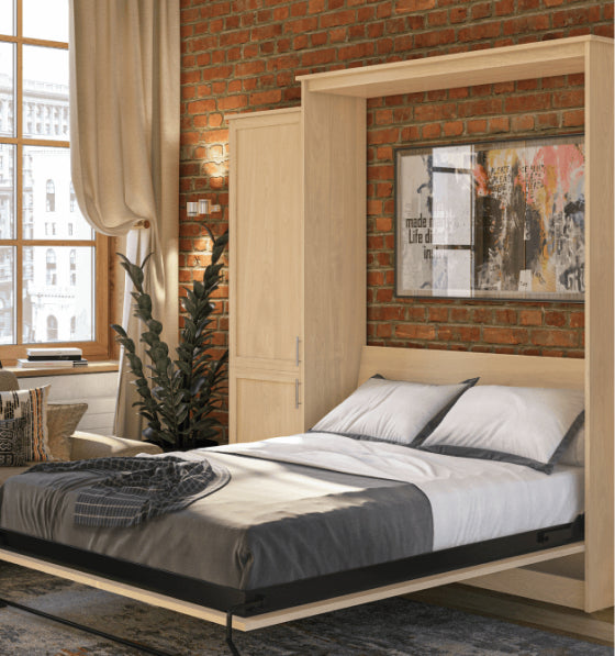 Murphy Door® wall bed with light wood frame, fold-down design, gray bedding, exposed brick wall, and urban loft aesthetic.