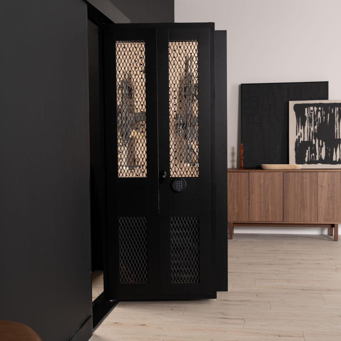 Murphy Door® black wine cabinet with diamond mesh doors, digital lock, and visible bottle storage in a modern home setting.