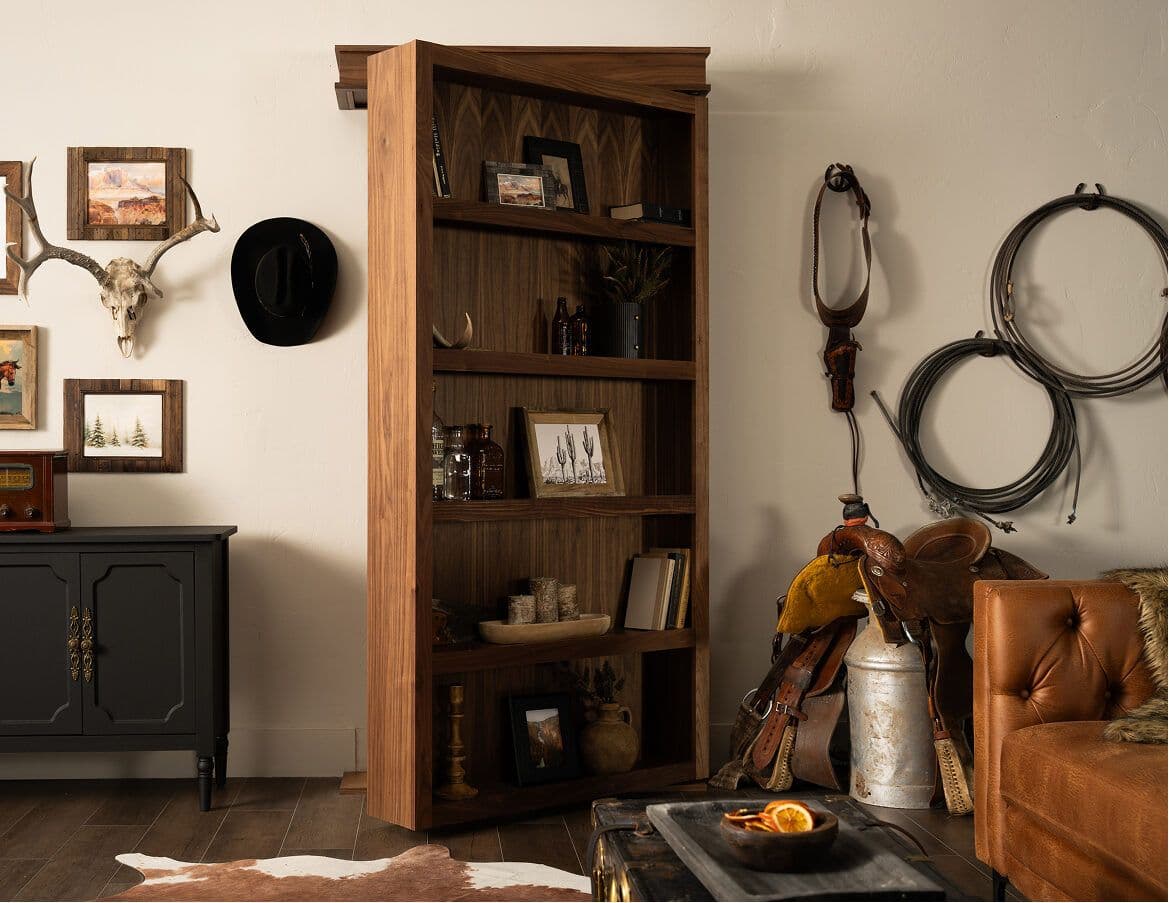 Surface mount hidden bookcase door mounted on the wall in a western-styled room
