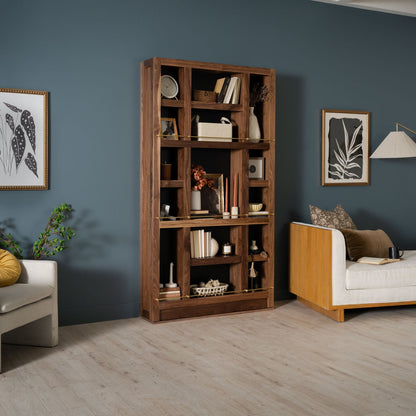 Murphy Door® wooden bookcase with compartments against blue wall, displaying decorative items and books in modern living room.