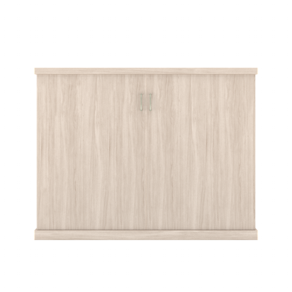 Murphy Door® light wood hidden door, two panels, slim silver handles, and light wood top and base trim.