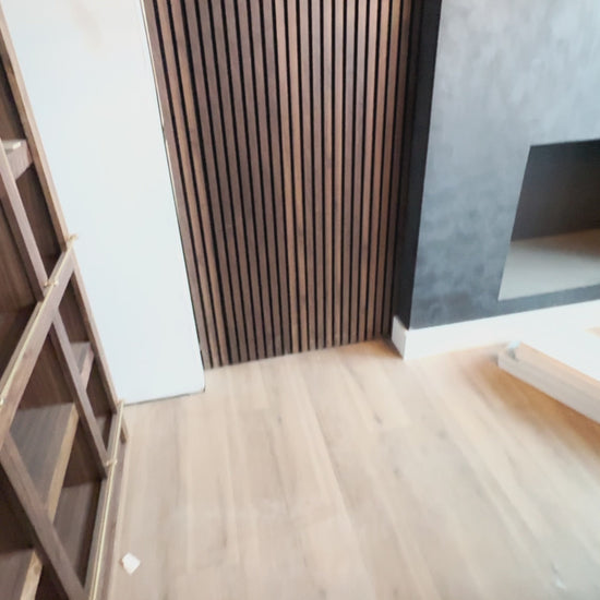 Murphy Door® Hidden Panel Door Kit (DIY, Flush Mount). A wooden slat door opens, revealing a room, then closes, blending seamlessly.