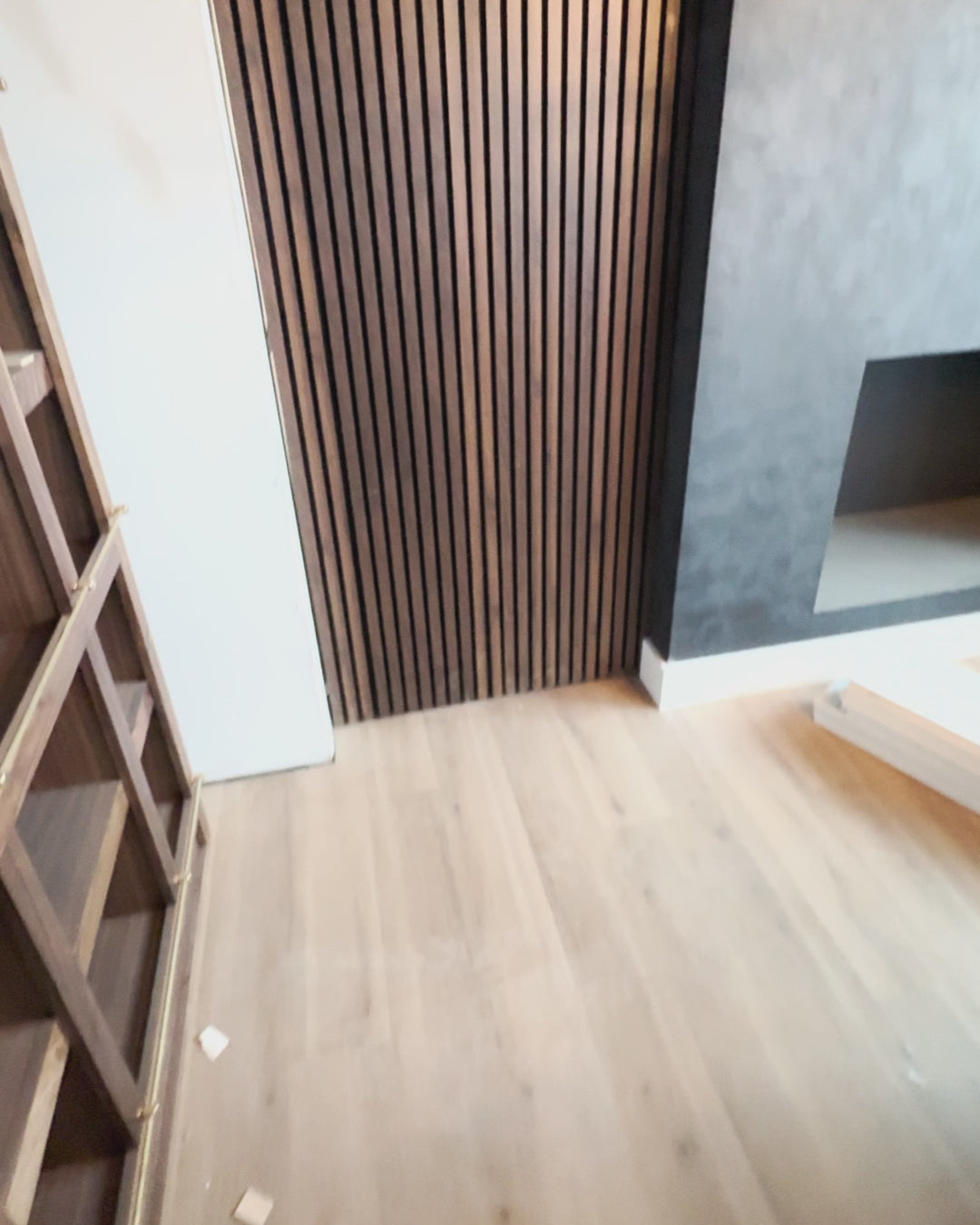 Murphy Door® Hidden Panel Door Kit (DIY, Flush Mount). A wooden slat door opens, revealing a room, then closes, blending seamlessly.