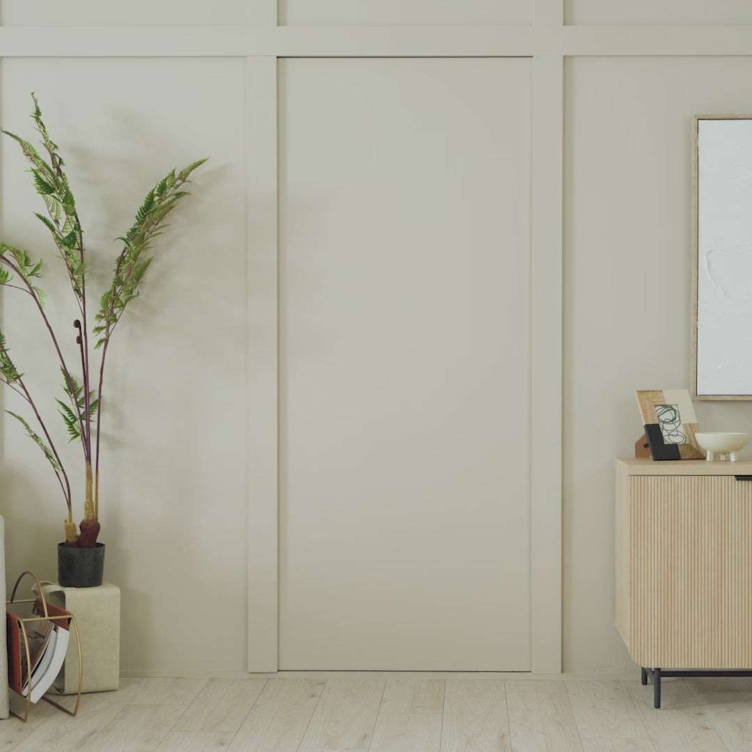 Load video: Showcasing the Hidden Panel Door from Murphy door, and how it blends seamlessly into the backgrounds.